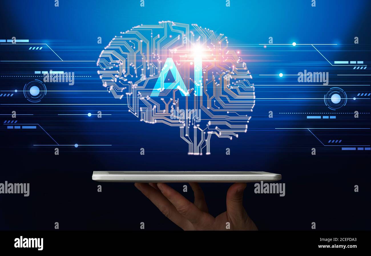 Hand holding digital tablet with human brain proection Stock Photo