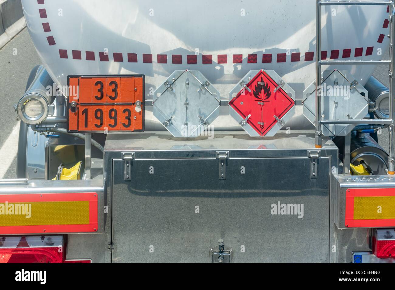 Rear view of a tank truck transporting highly flammable dangerous goods. Stock Photo