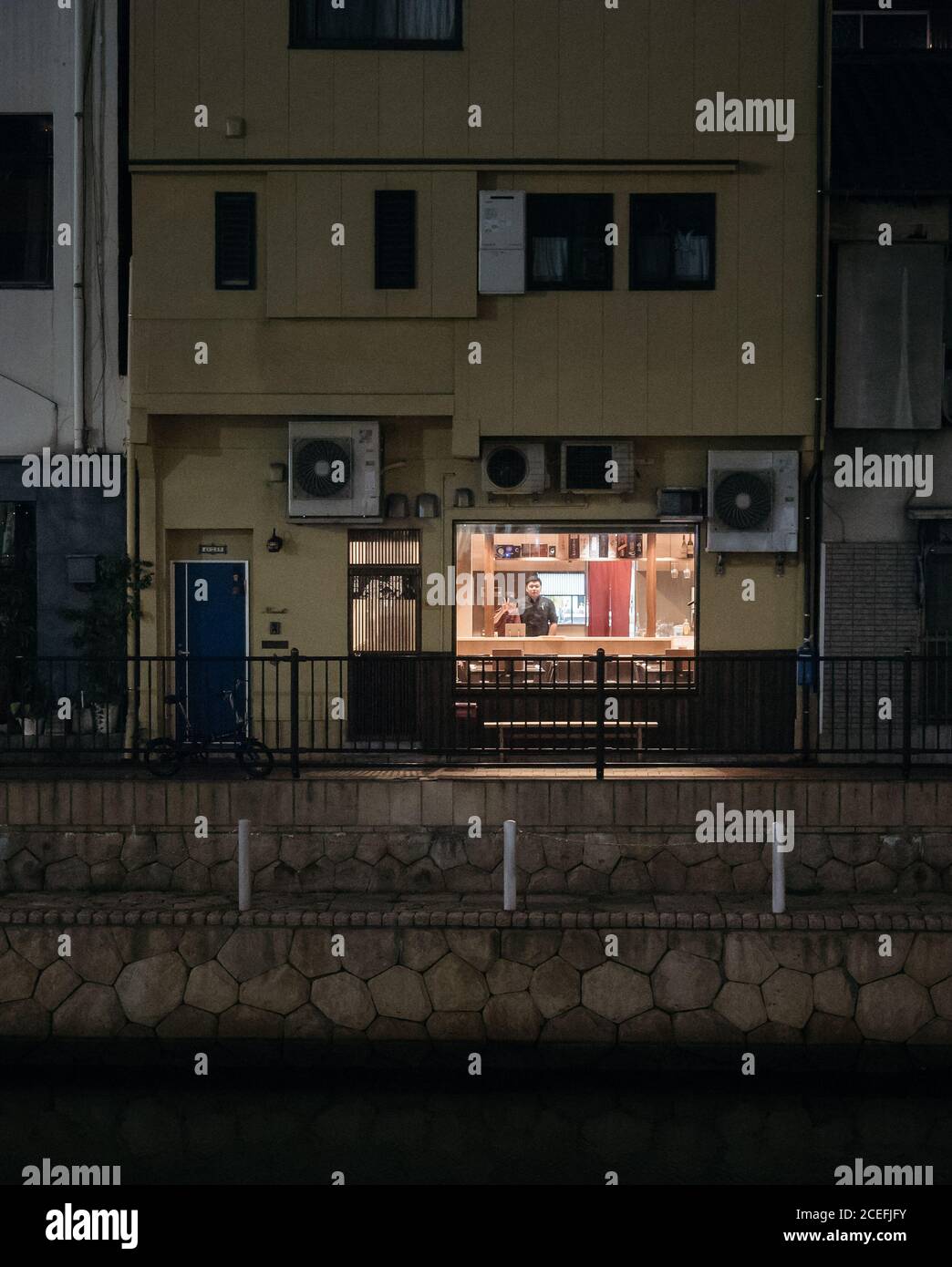 Fukuoka, Kyushu, Japan - Managers in a small restaurant located by the river. Kind local people. Peaceful and quiet time at night in a village. Stock Photo