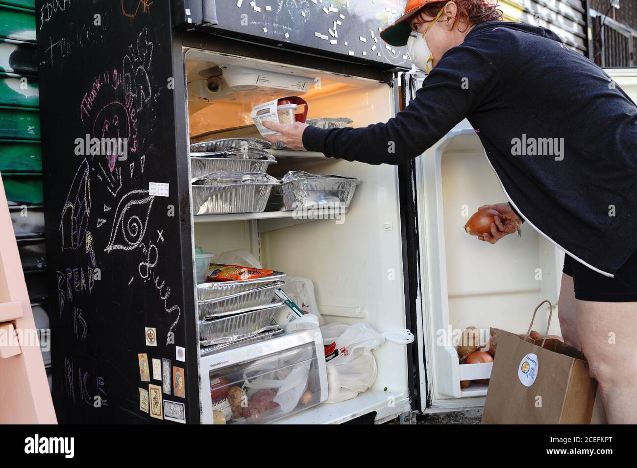 New York, USA. 16th May, 2020. A woman stocking up the Knickerbocker