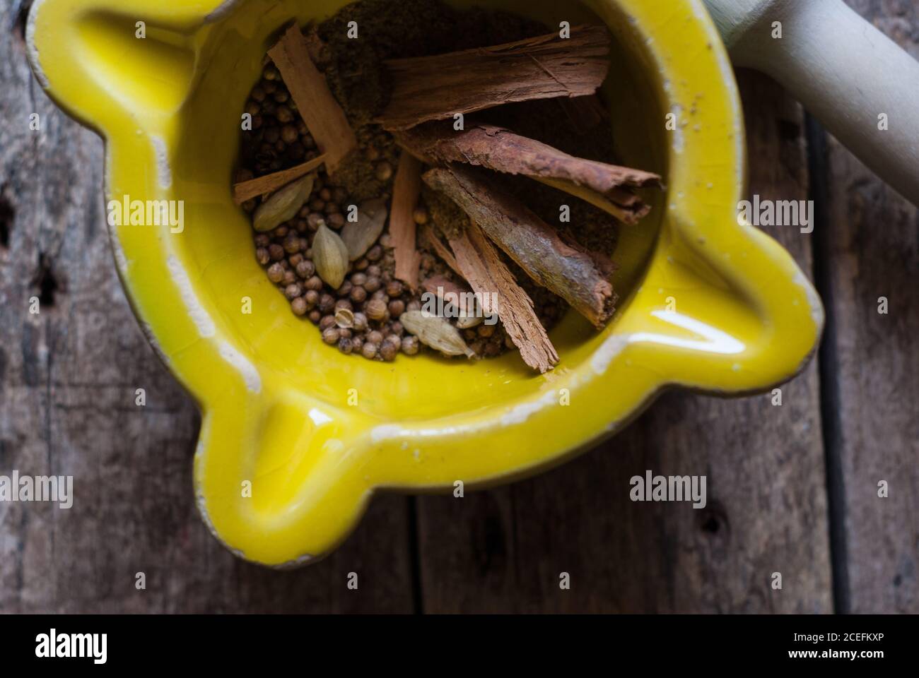 Mortal and pestle with spices Stock Photo