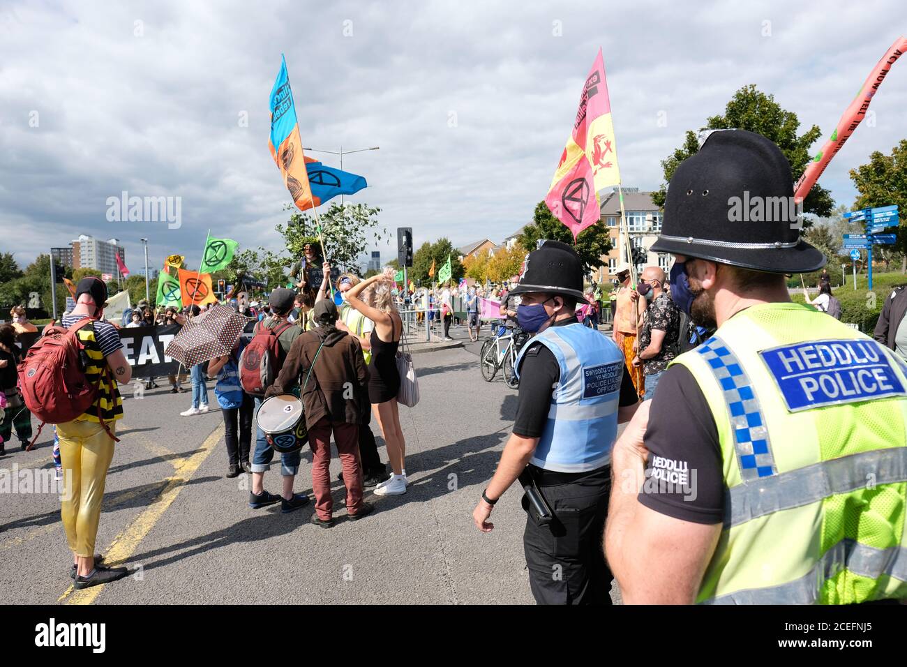 Cardiff, Wales, UK - Tuesday 1st September 2020 - Police officers monitor the Extinction Rebellion ( XR ) protesters as they march from central Cardiff down to Cardiff Bay protesting against climate change and the future of society. Photo Steven May / Alamy Live News Stock Photo