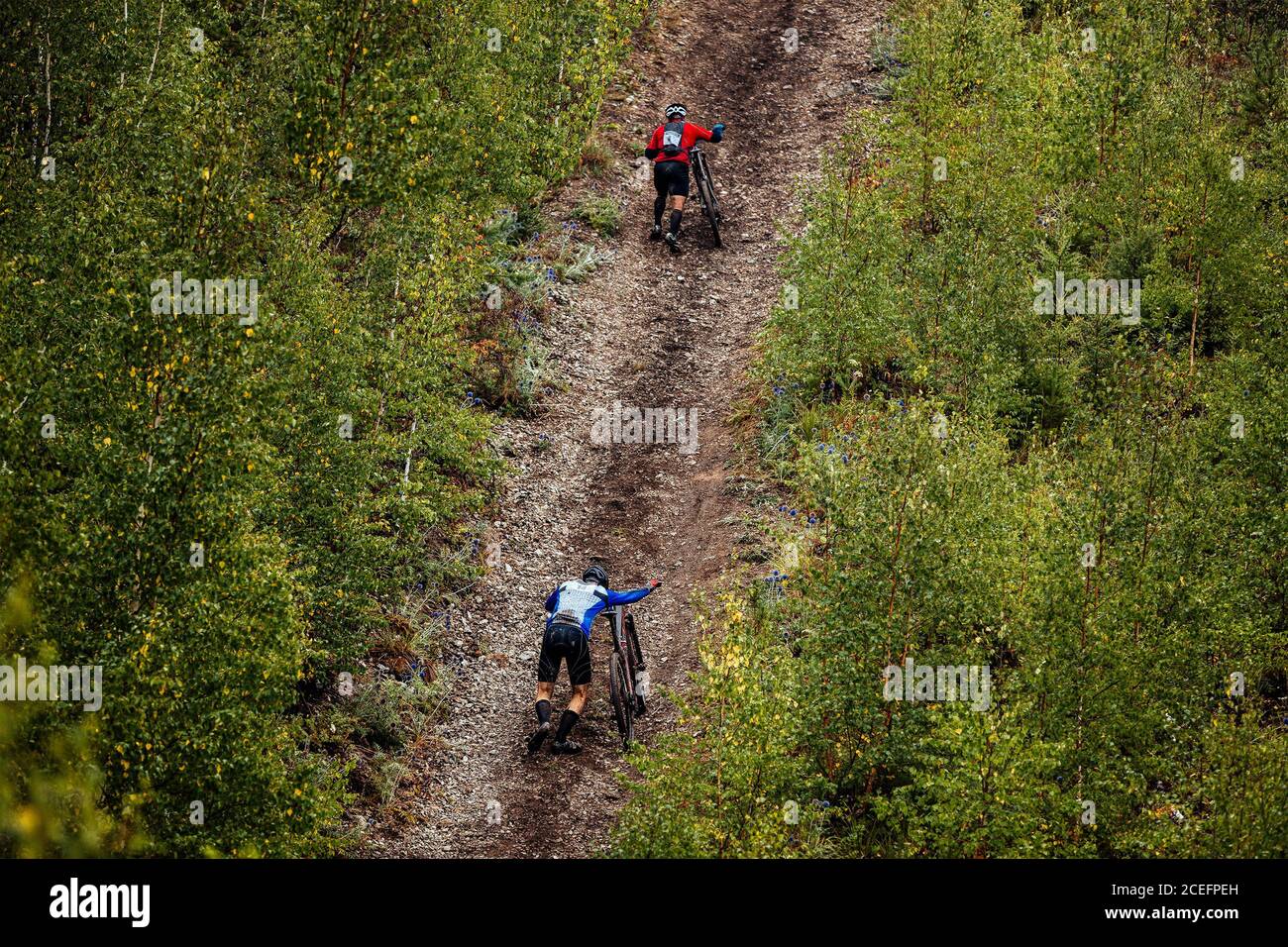 Two people walking uphill hi-res stock photography and images - Alamy