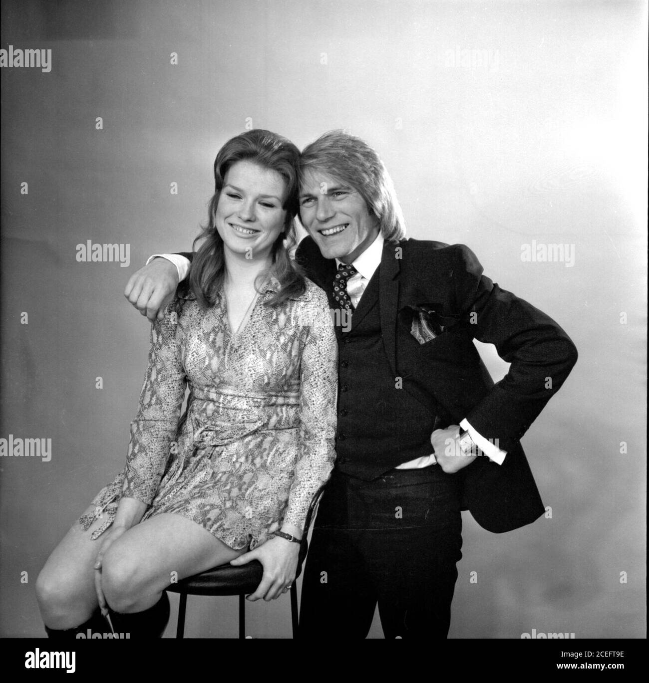 Actor, singer and popstar Adam Faith and actress Lynn Dalby, stars of the London Weekend Television hit show, Budgie, smile for the camera Stock Photo