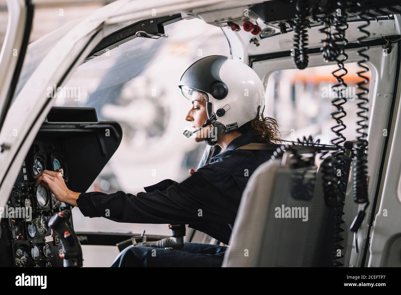 Pilot Woman inside a helicopter Stock Photo - Alamy
