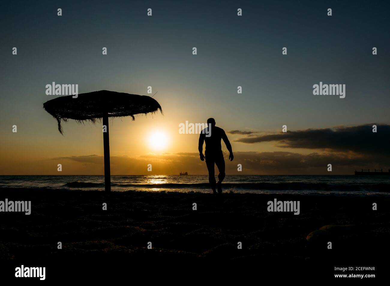 Old man walking on beach hi-res stock photography and images - Alamy