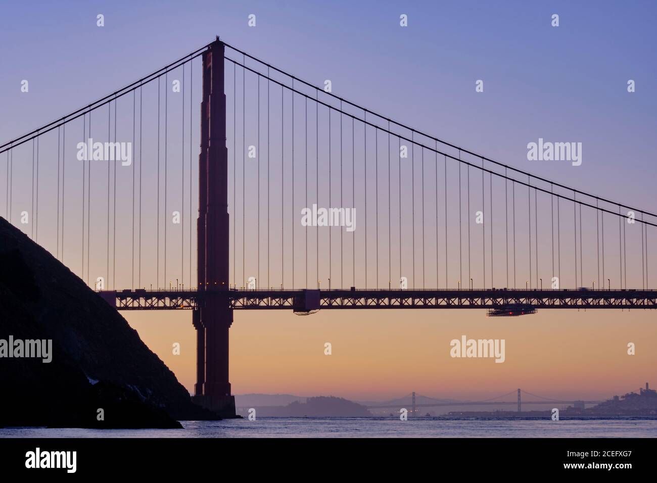 United States of America, California, Golden Gate Bridge. The iconic Golden Gate Bridge in San Francisco viewed from Kirby Cove at dawn. Stock Photo