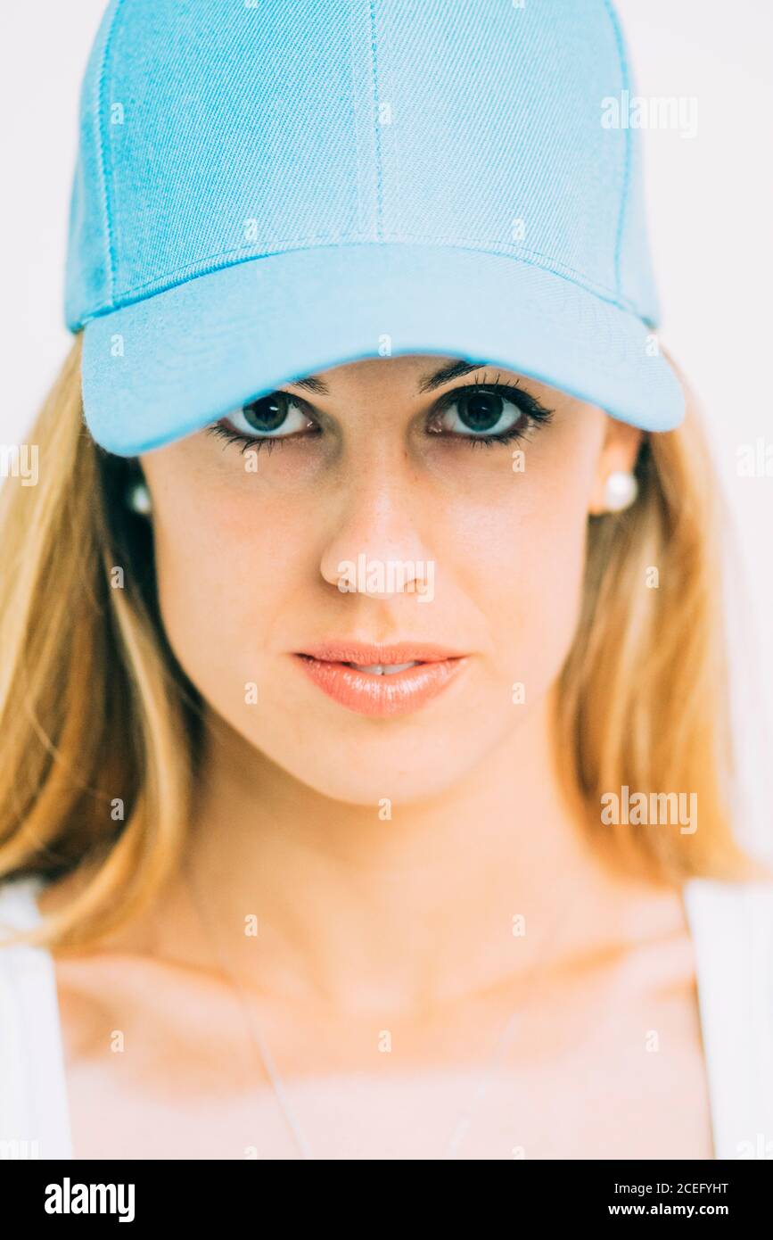 SportsWoman in blue cap standing in studio Stock Photo
