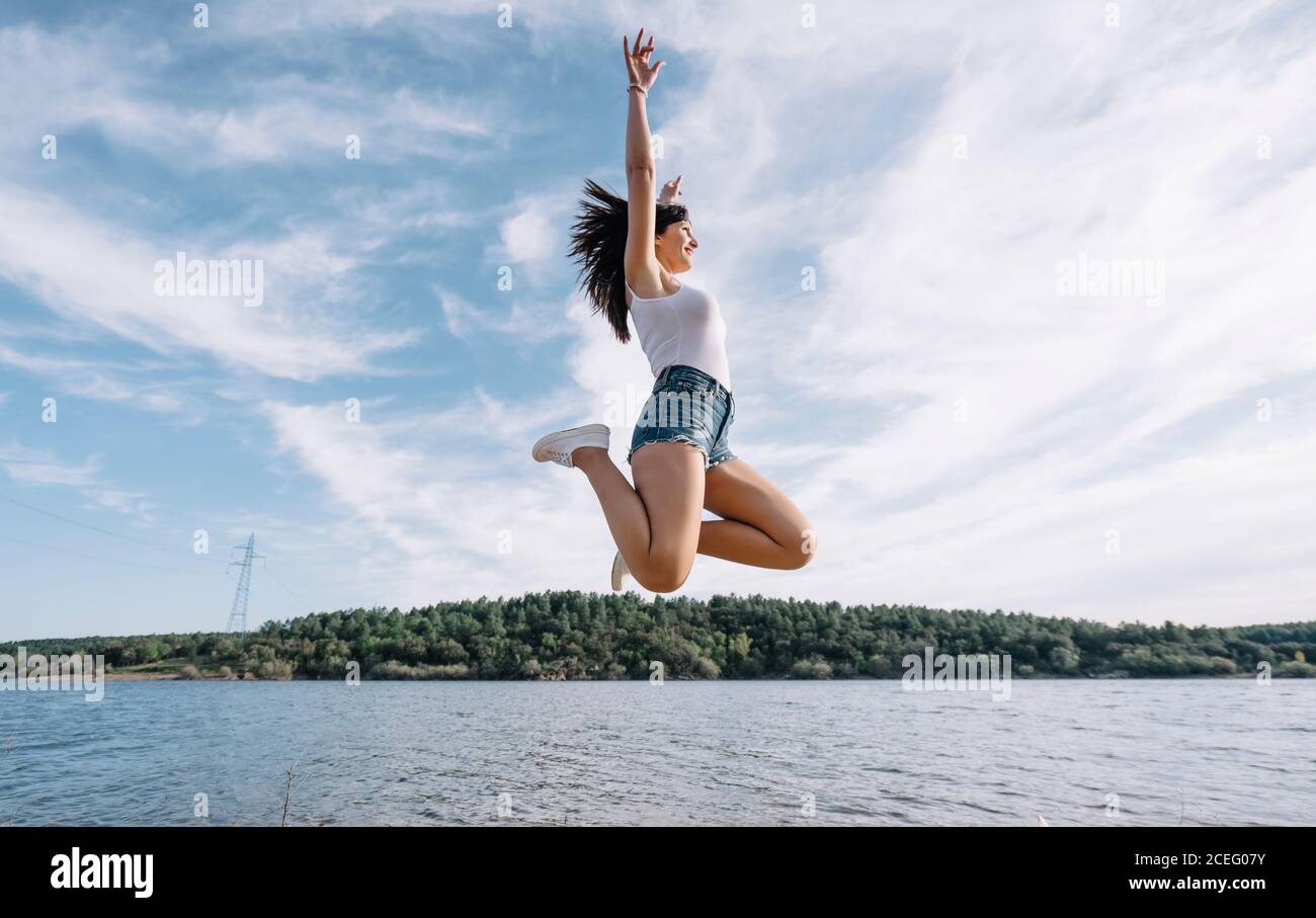 Woman jumps lake hi-res stock photography and images - Alamy