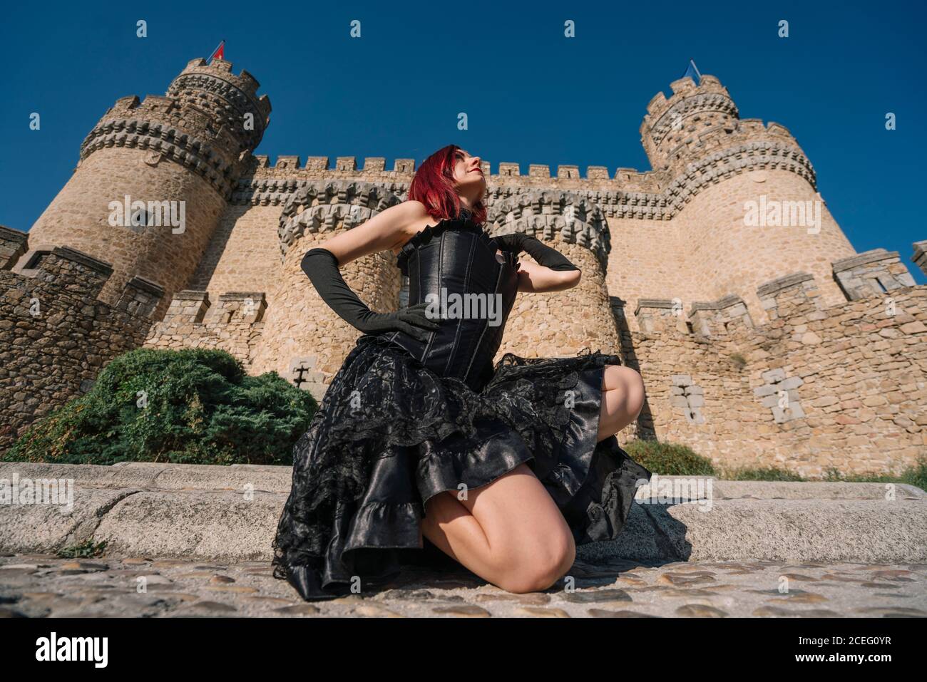 Pretty red haired medieval girl poses together castle Stock Photo - Alamy