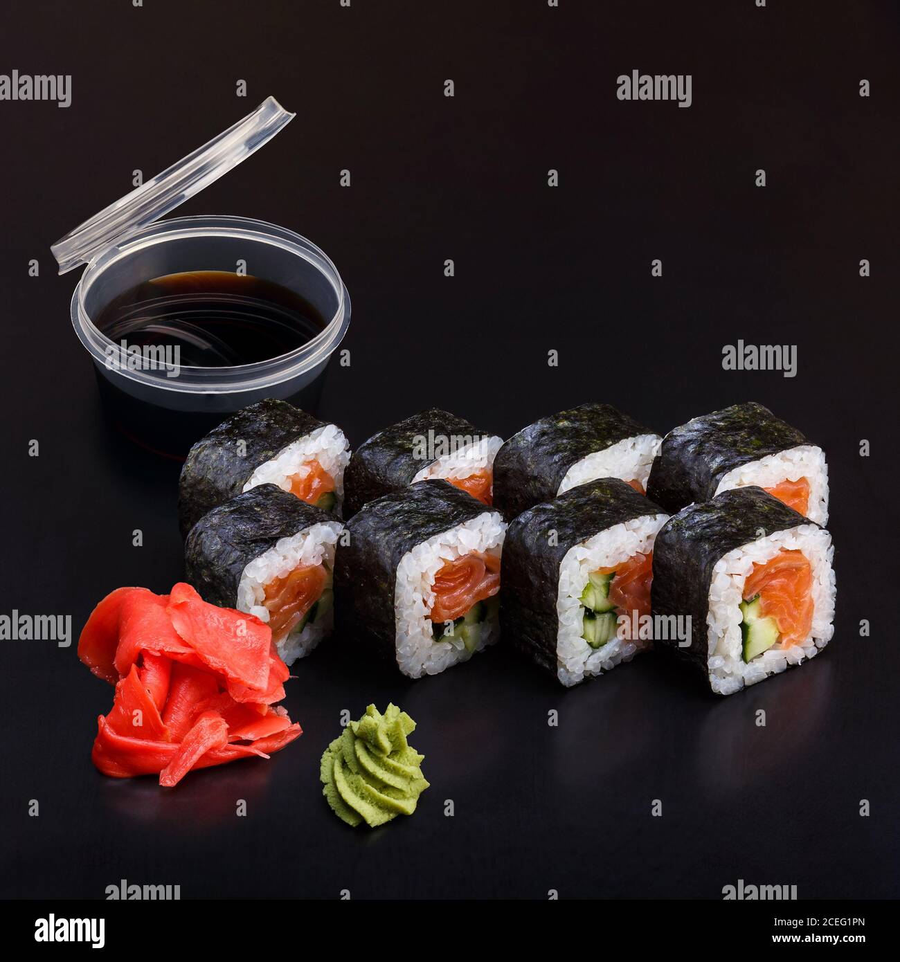 Traditional delicious fresh Syake Kappa sushi roll set on a black  background with reflection. Sushi roll with rice, nori, salmon, cucumber.  Sushi menu Stock Photo - Alamy