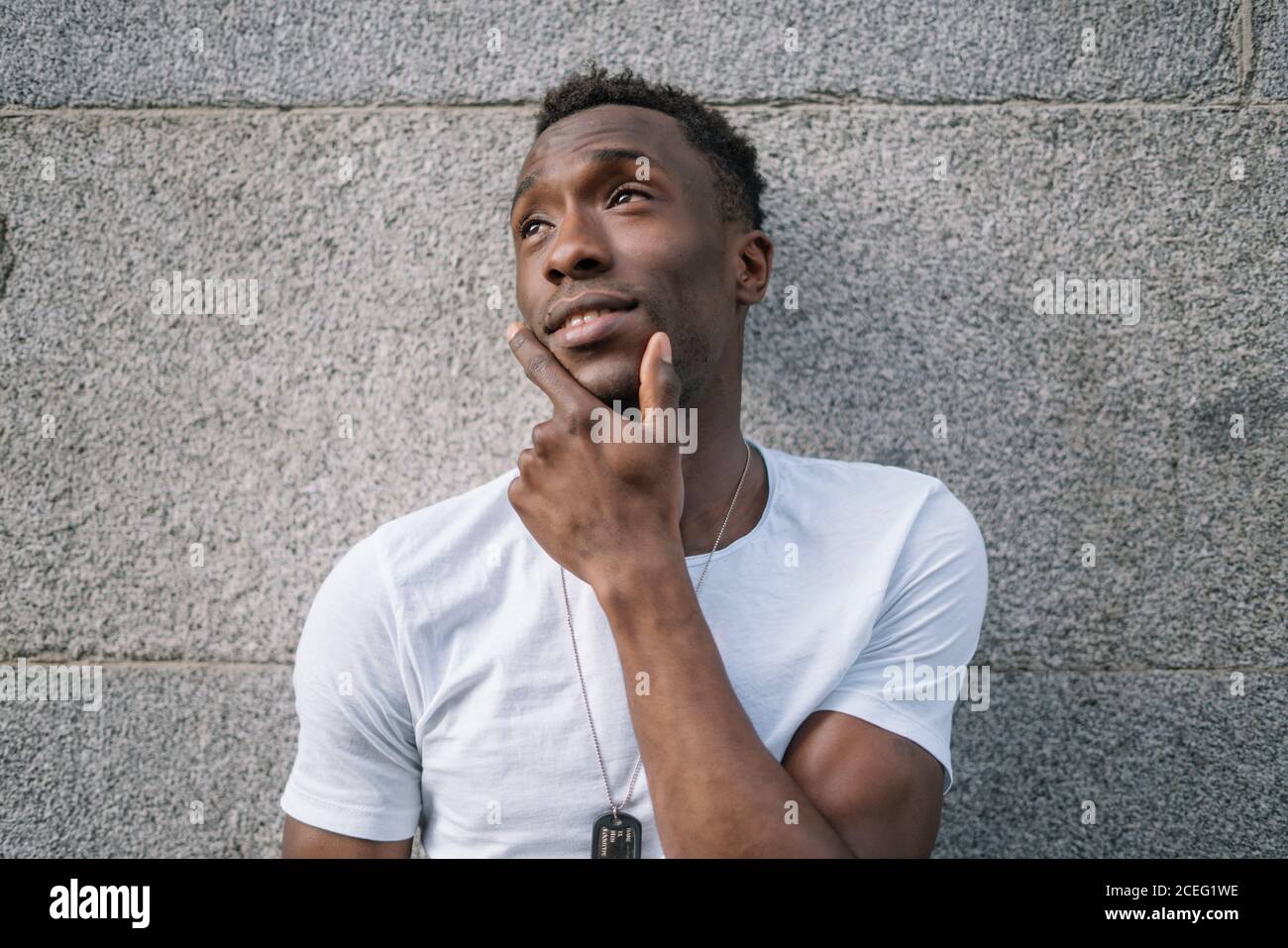 African man in white shirt posing. Stock Photo