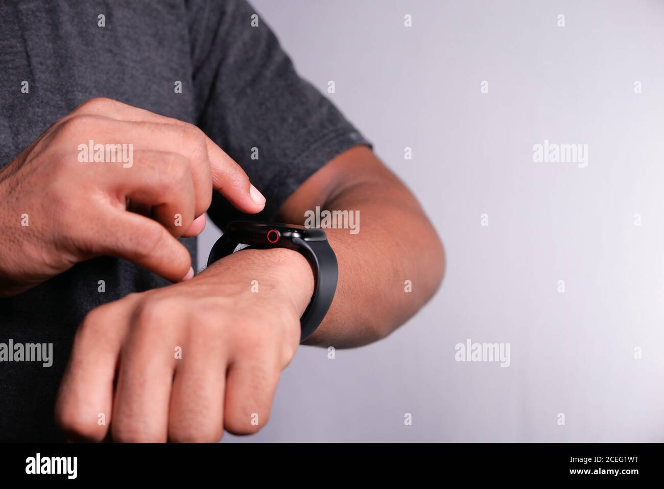 top-view-of-mans-hand-using-smart-watch-2CEG1WT.jpg