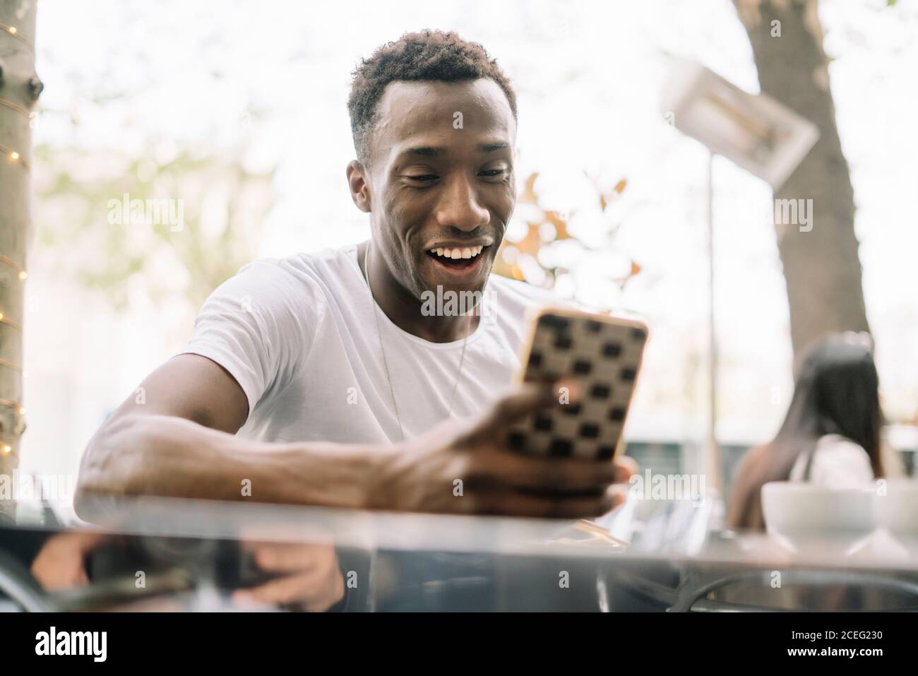 African man using mobile phone. Stock Photo