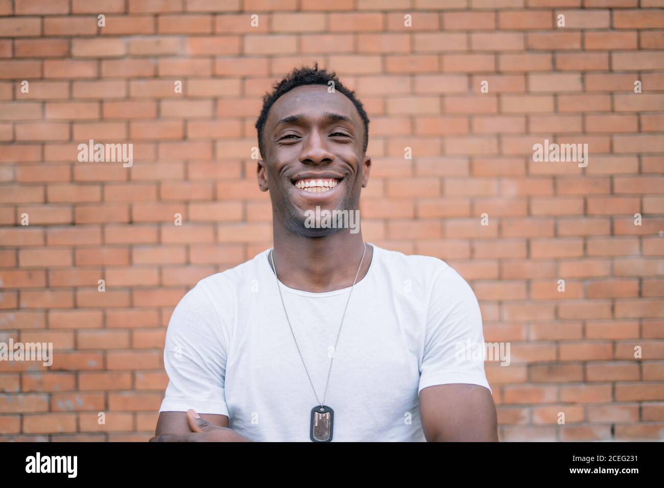 African man in white shirt posing. Stock Photo