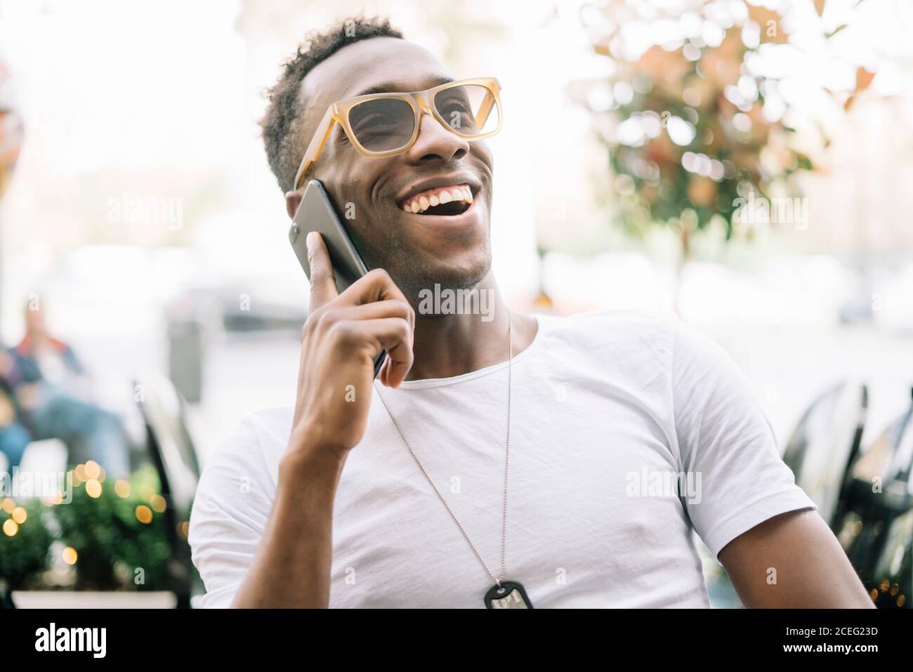 African man using mobile phone. Stock Photo