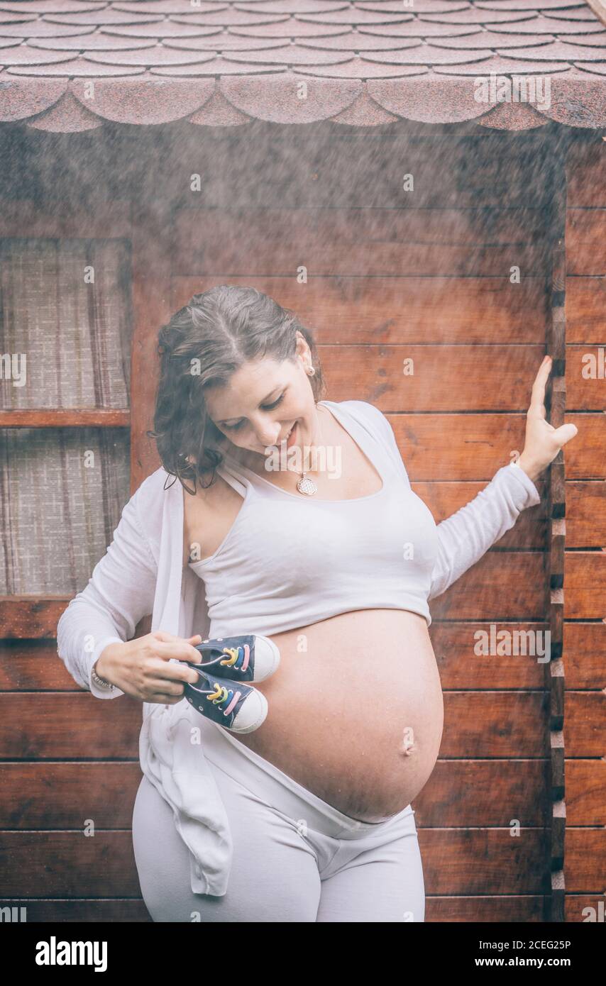 Beautiful pregnant Woman posing in the rain Stock Photo Alamy