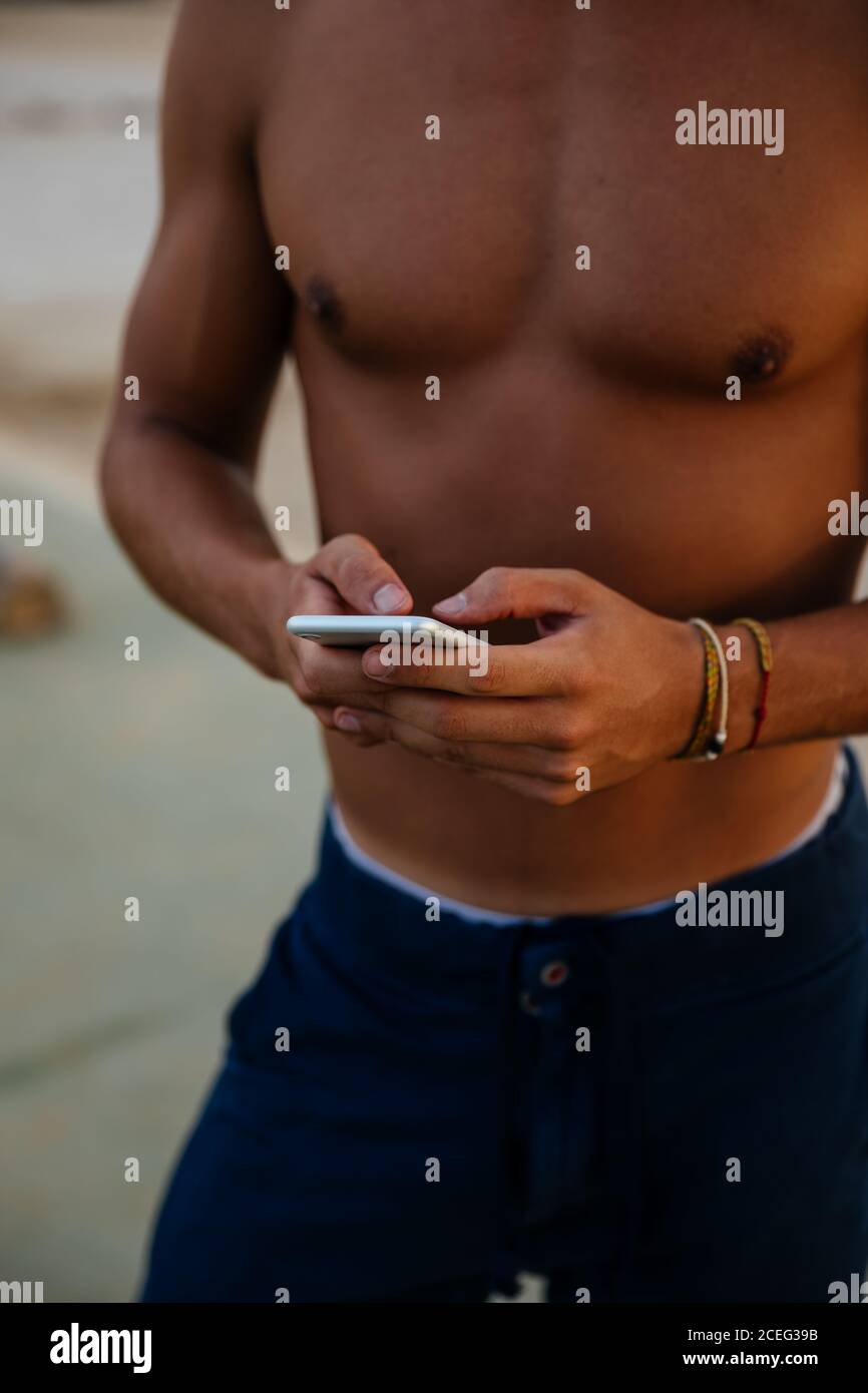 Athlete man training outdoors with mobile. Stock Photo