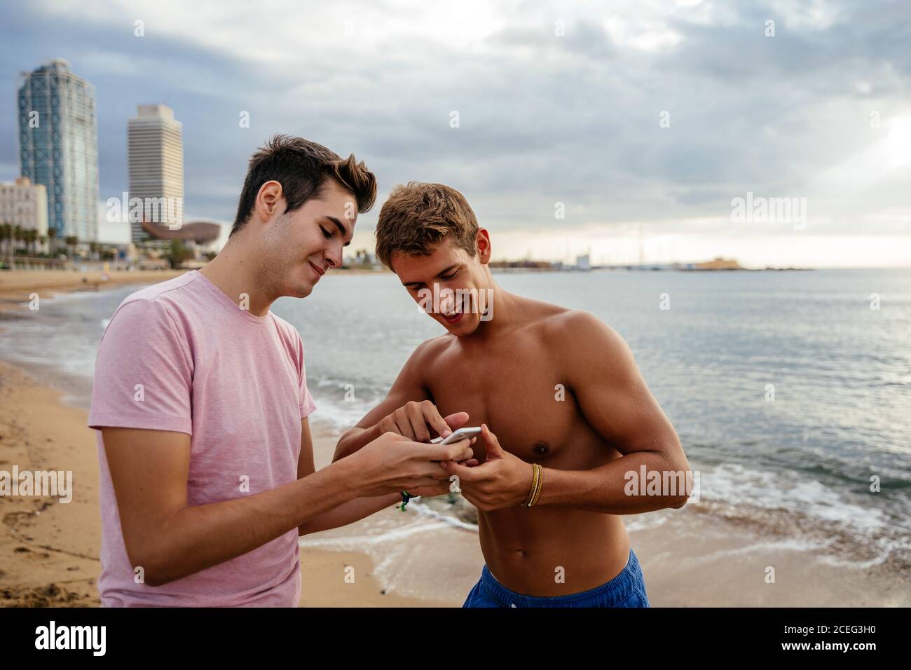 Athletes training outdoors with mobile. Stock Photo