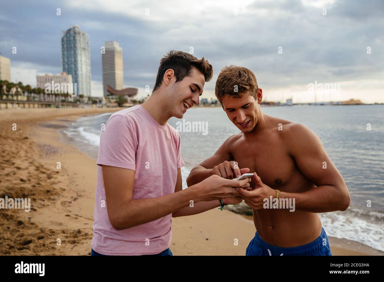 Athletes training outdoors with mobile. Stock Photo