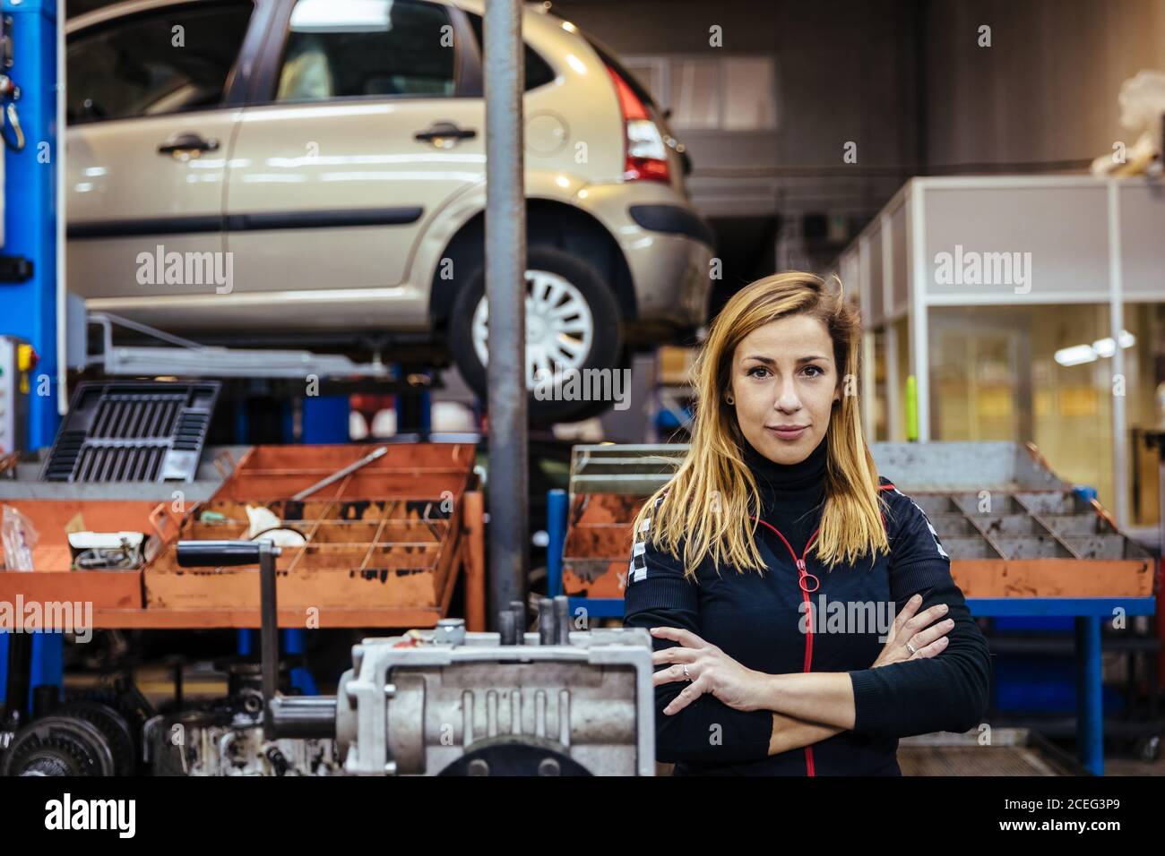Woman working in a mechanical workshop Stock Photo