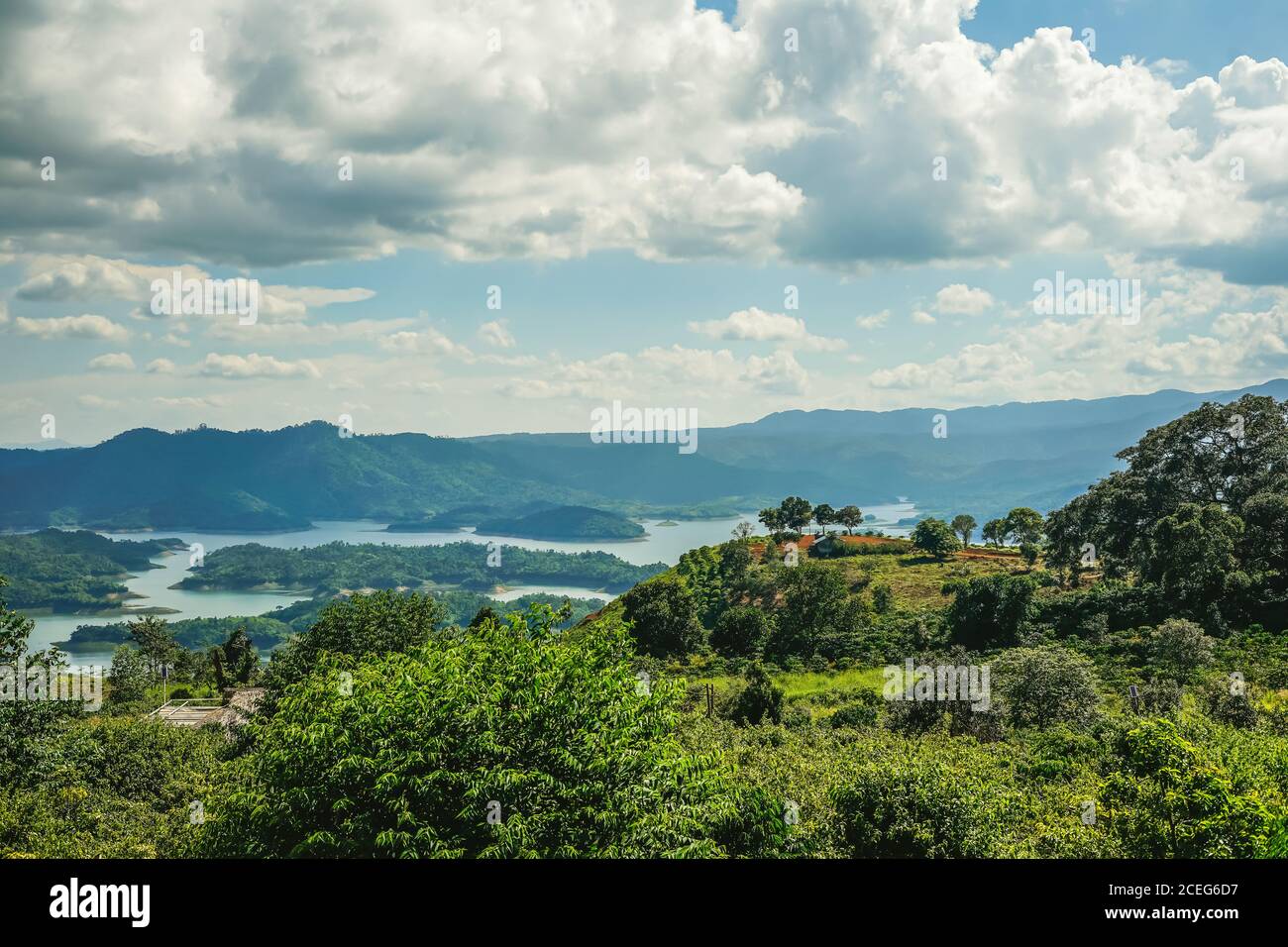 Ta Dung lake in the summer. Blue sky and cloudy on the lake and the trees on the small island paradise. Dak Nong global geological park, Dak Nong prov Stock Photo