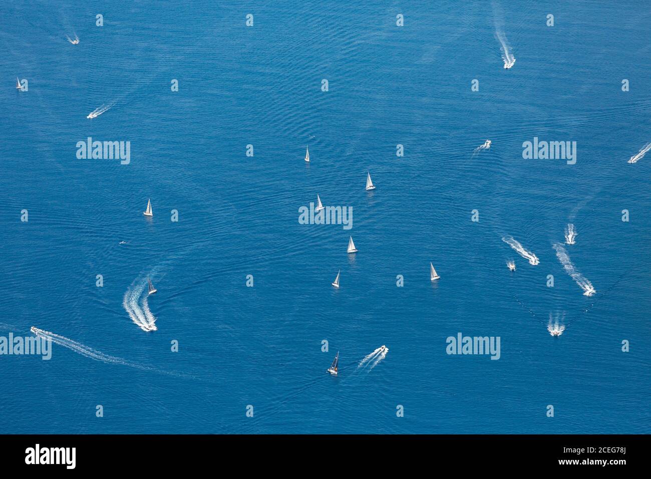 Aerial view of various motorboats floating on surface of calm sea Stock ...