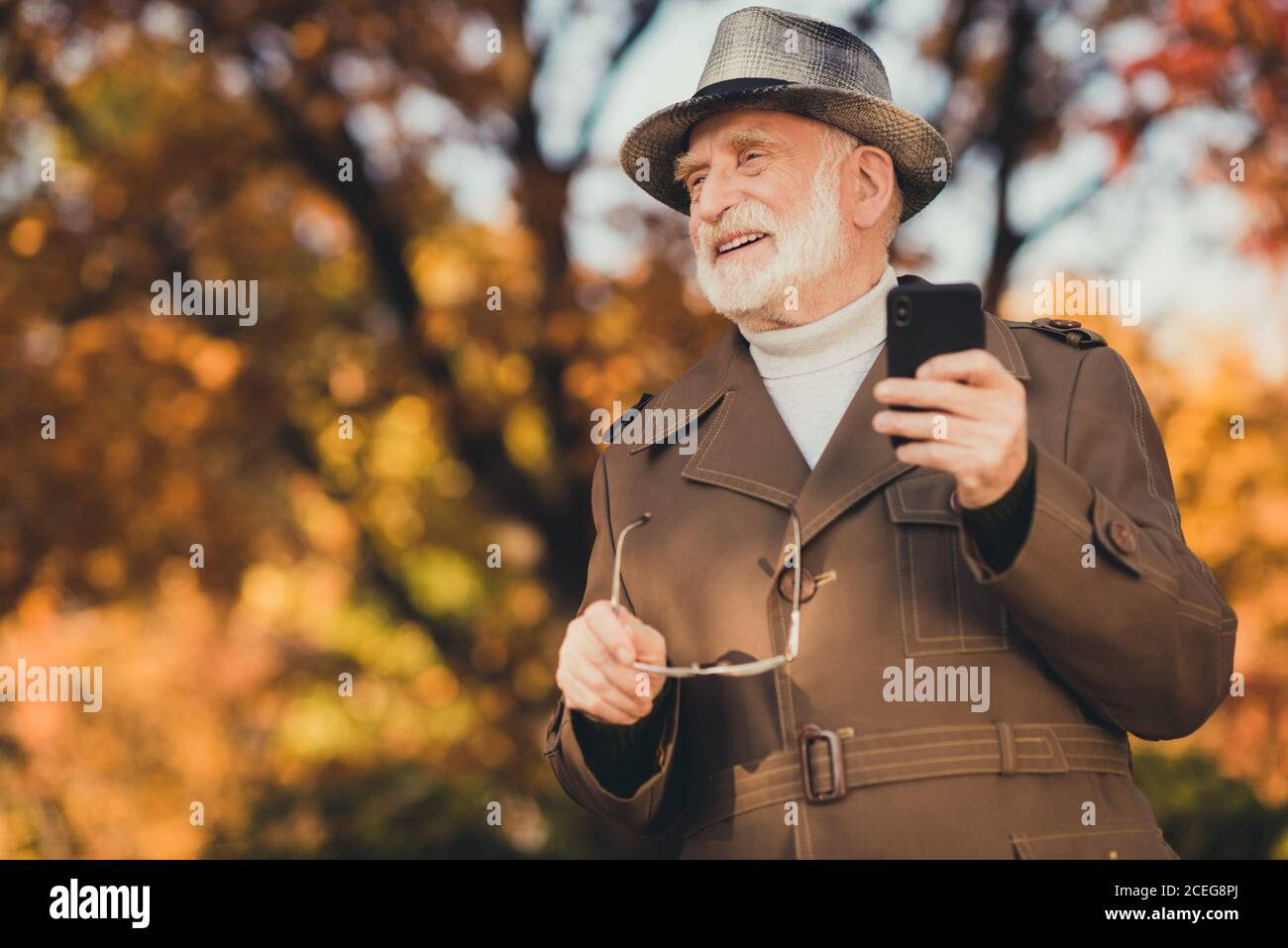 Download Photo Of Aged Funny White Hair Grandpa Hold Specs Telephone See Grandchildren Family Take Off Specs Glad Meet Gathering Sunny Day Weekend Wear Jacket Stock Photo Alamy