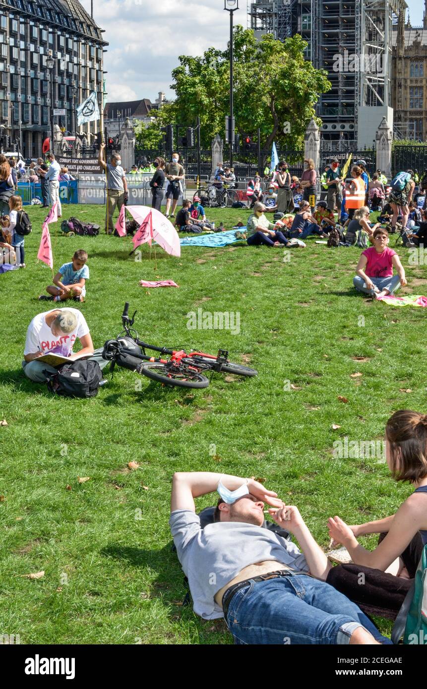 Thousands of Extinction Rebellion protesters converge upon Parliament Square in central London blocking roads in and out of the area demanding the government listen to their demand for a citizen's assembly to tackle climate change. Stock Photo
