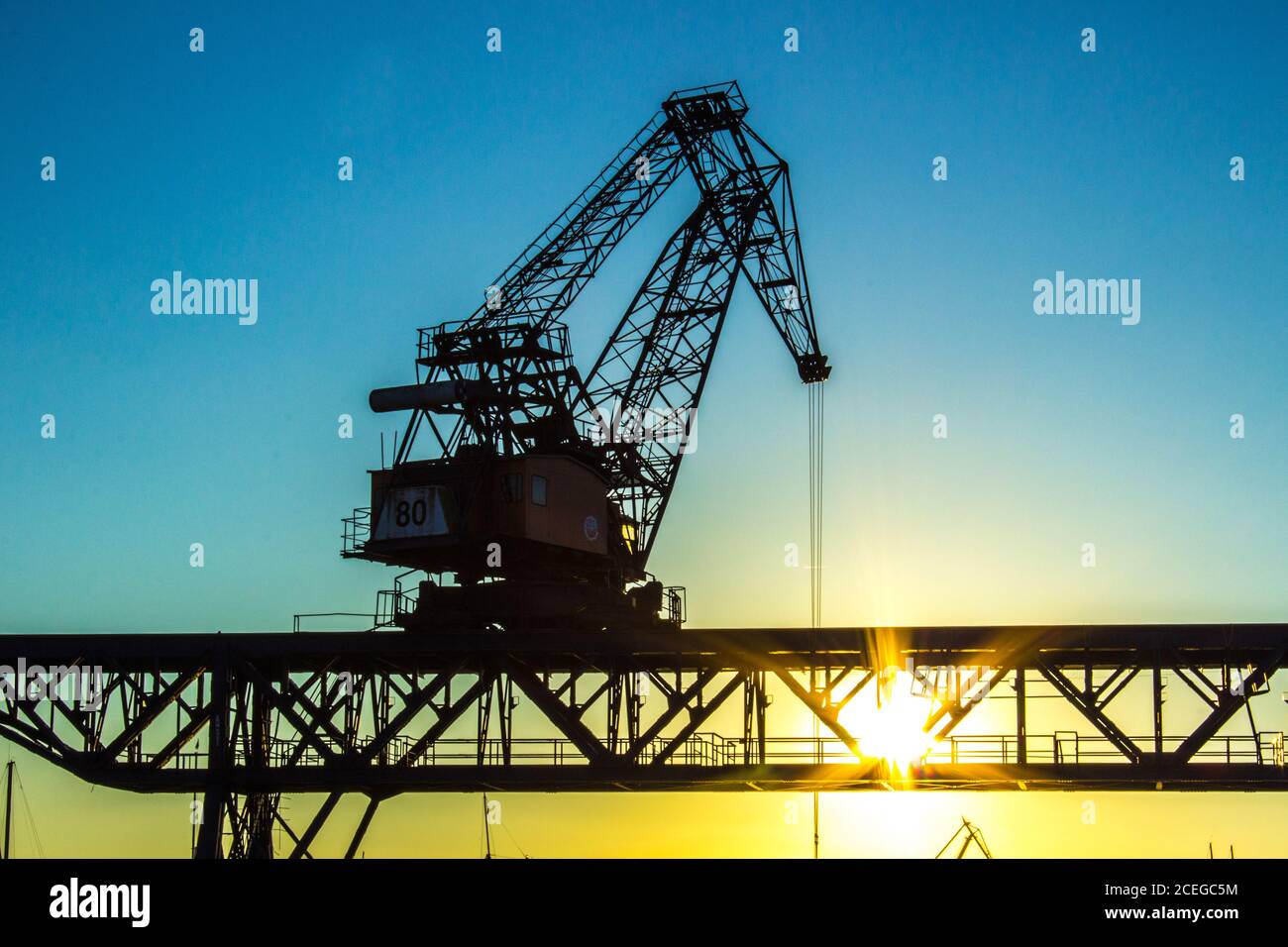 Gantry crane reloader at sunset Stock Photo