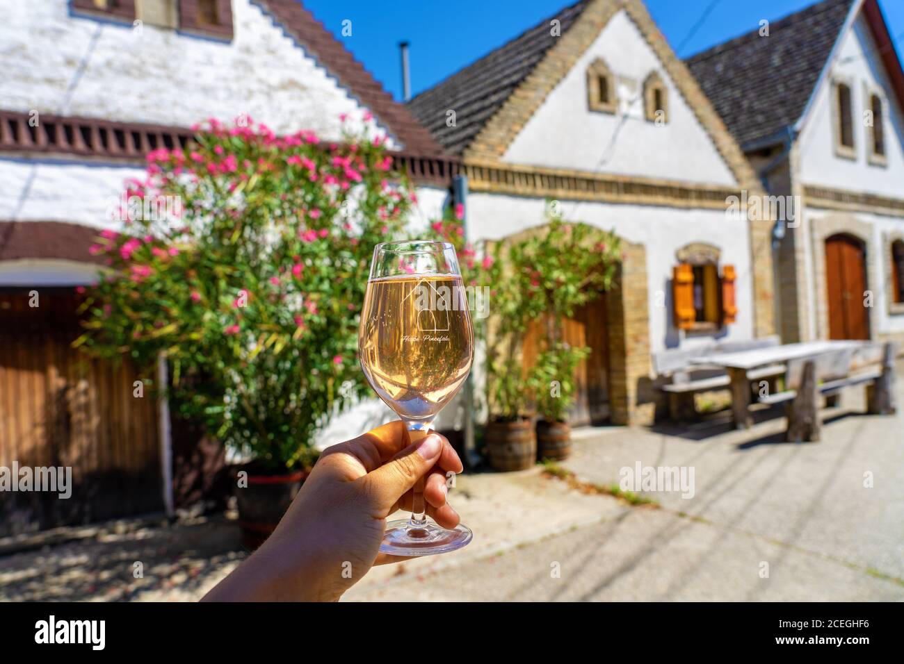 Hajos, Hungary - 08.21.2020: drinking rose wine with soda in Hajos cellar village on a terrace with roof tops pincefalu means cellar village Stock Photo