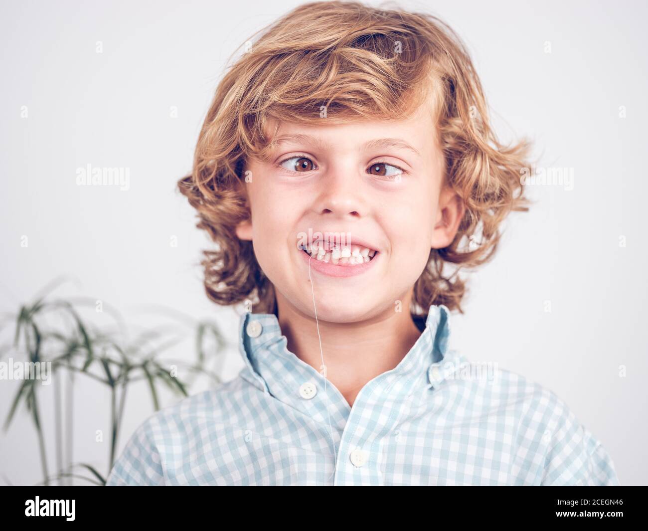 Little boy pulling tooth out making faces Stock Photo Alamy