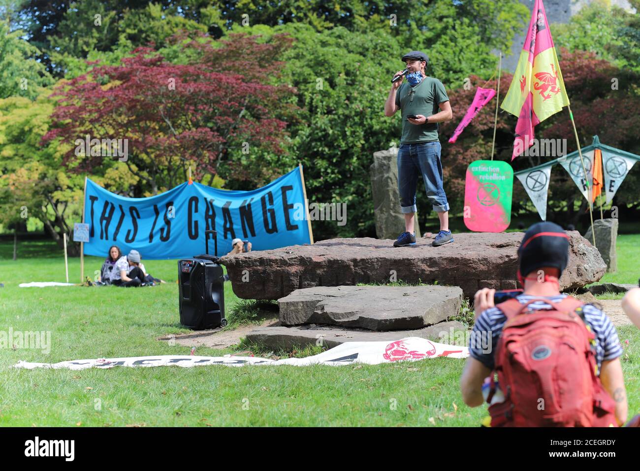 Cardiff, Wales, UK. 1st September 2020. Extinction Rebellion protestors take over Cardiff and march on the Senedd to demand a green recovery and passing of the CEE Bill on day one of a week of action. Speeches are held in Bute Park welcoming protestors Credit: Denise Laura Baker/Alamy Live News Stock Photo