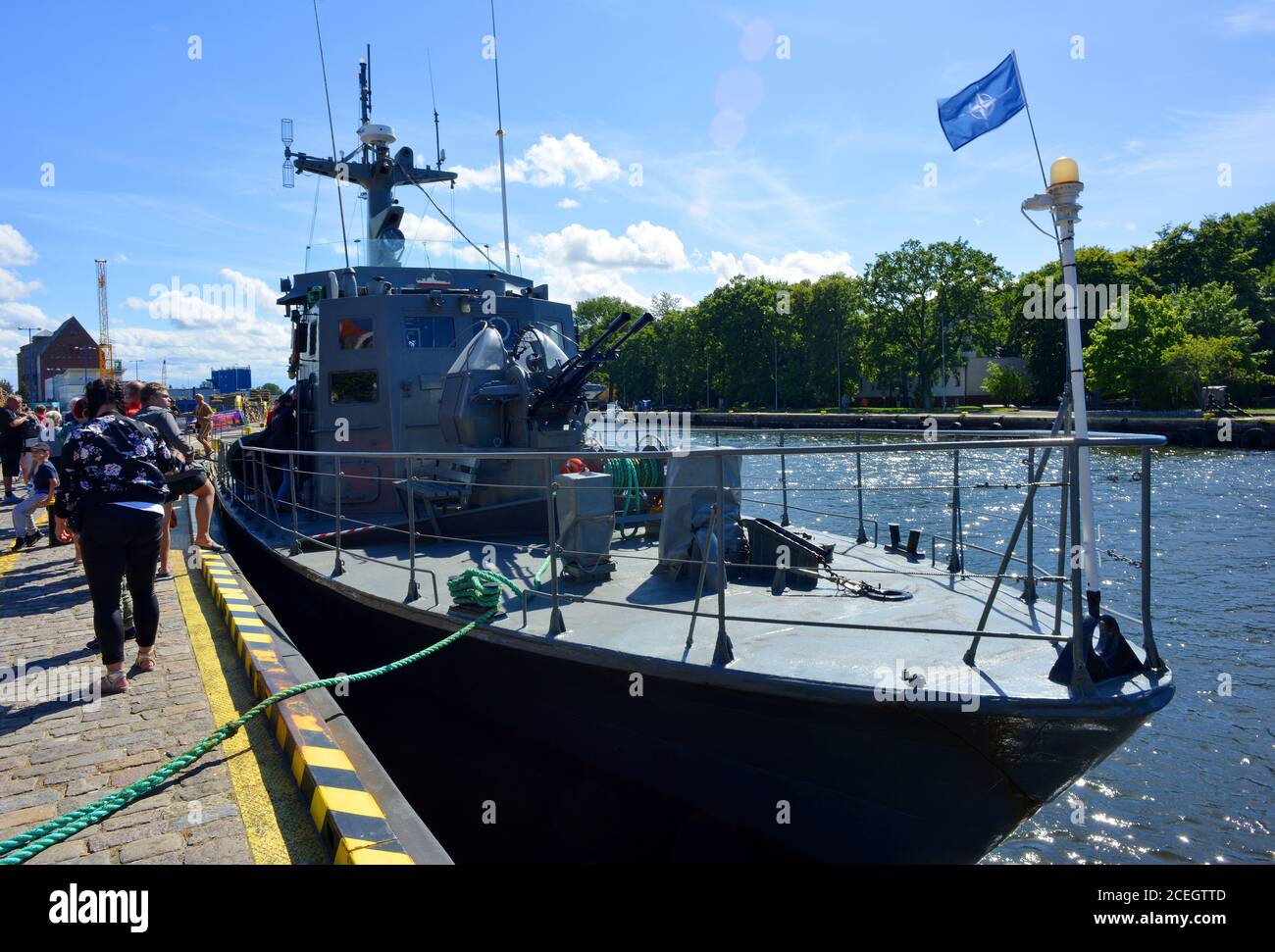 Kolobrzeg, Poland, a torpedo boat in the harbor with tourists and visitors Stock Photo