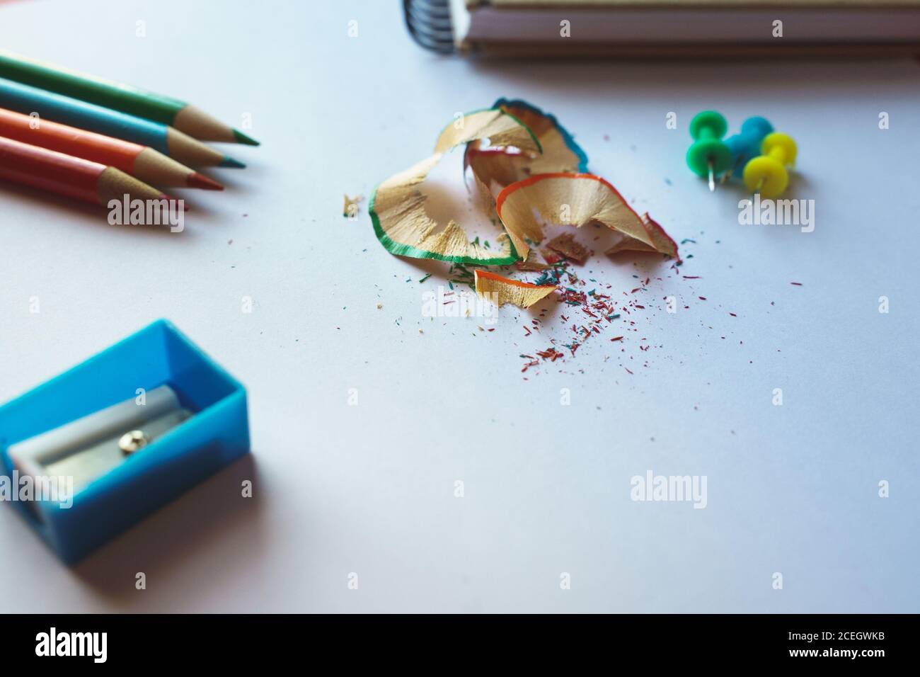 Closeup shot of different school supplies on a white surface Stock Photo