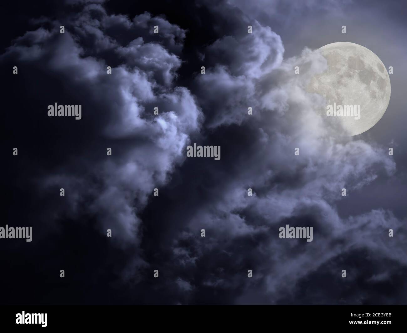 Cloudy full moon night sky background Stock Photo - Alamy