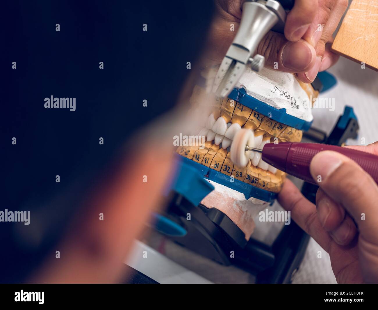 Dental technician polishing teeth Stock Photo Alamy