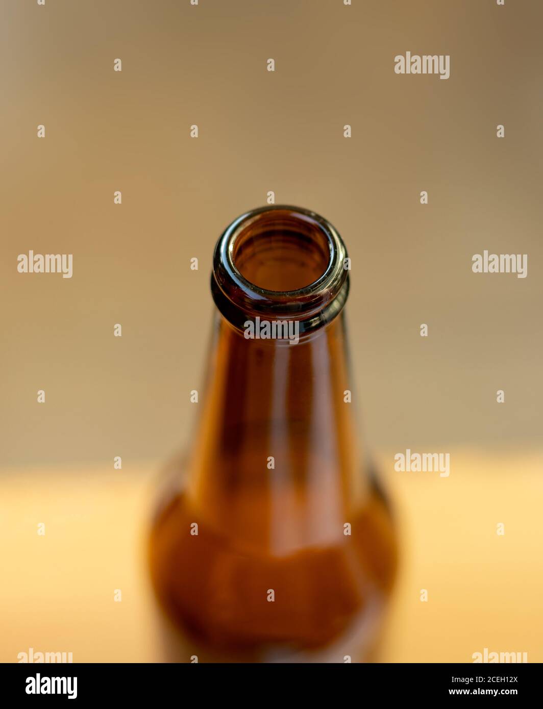 Close-up view of brown glass bottle, focus on the rim. Stock Photo