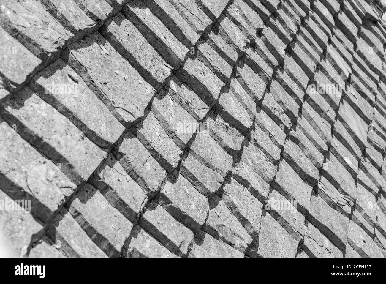 MOSTAR, BOSNIA HERZEGOVINA - 2017 AUGUST 16. Close up of a stone tiles on a house roof in the city of Mostar. Stock Photo
