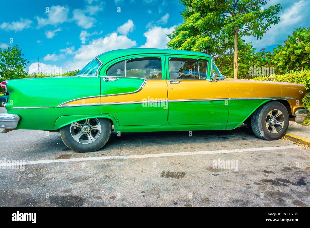 Cuba, February 2016 - Green Classic vintage American car parked on a road in Cuba.  Stock Photo