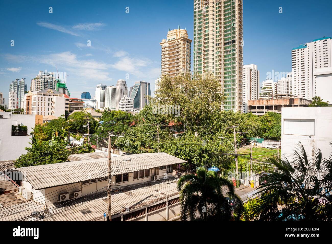 View of View across rooftops and towards high rise condos in central Bangkok ...