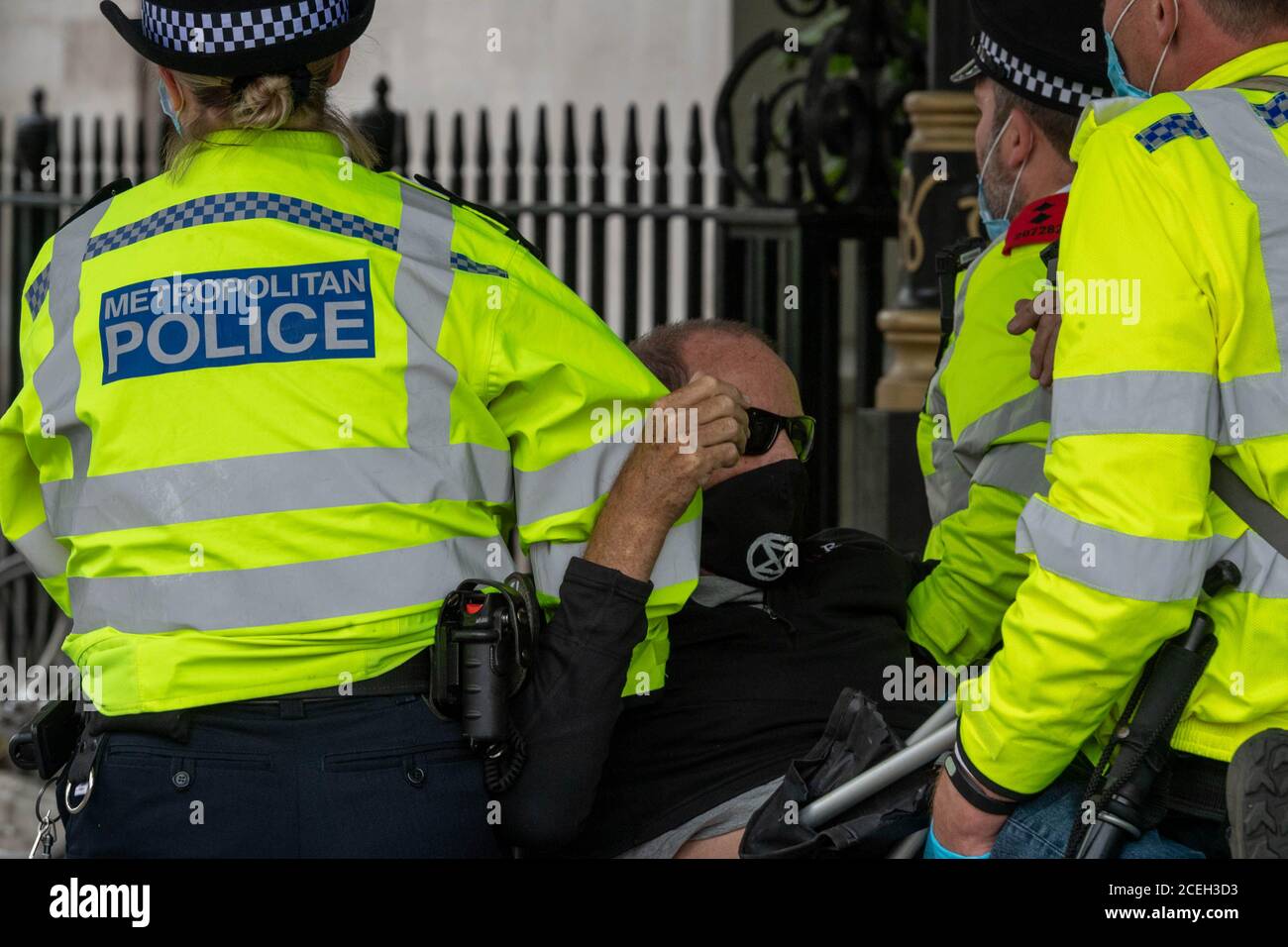 London, UK. 1st Sep, 2020. XR (Extinction Rebellion ) protesters are moved off the road outside the Houses of Parliament by the police to clear the highway Credit: Ian Davidson/Alamy Live News Stock Photo
