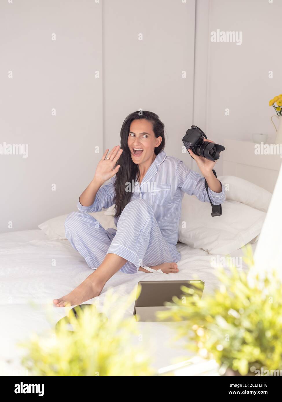 Young Woman wearing blue pajamas Stock Photo