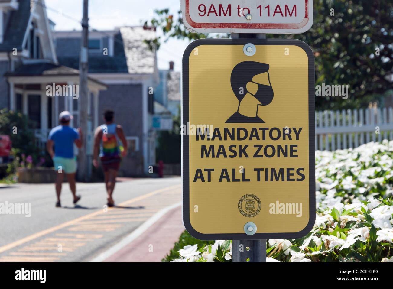 Sign for Mandatory Mask Zone in Provincetown, MA. To prevent spread of Covid-19, people must wear masks in the business district 24 hours a day. Stock Photo