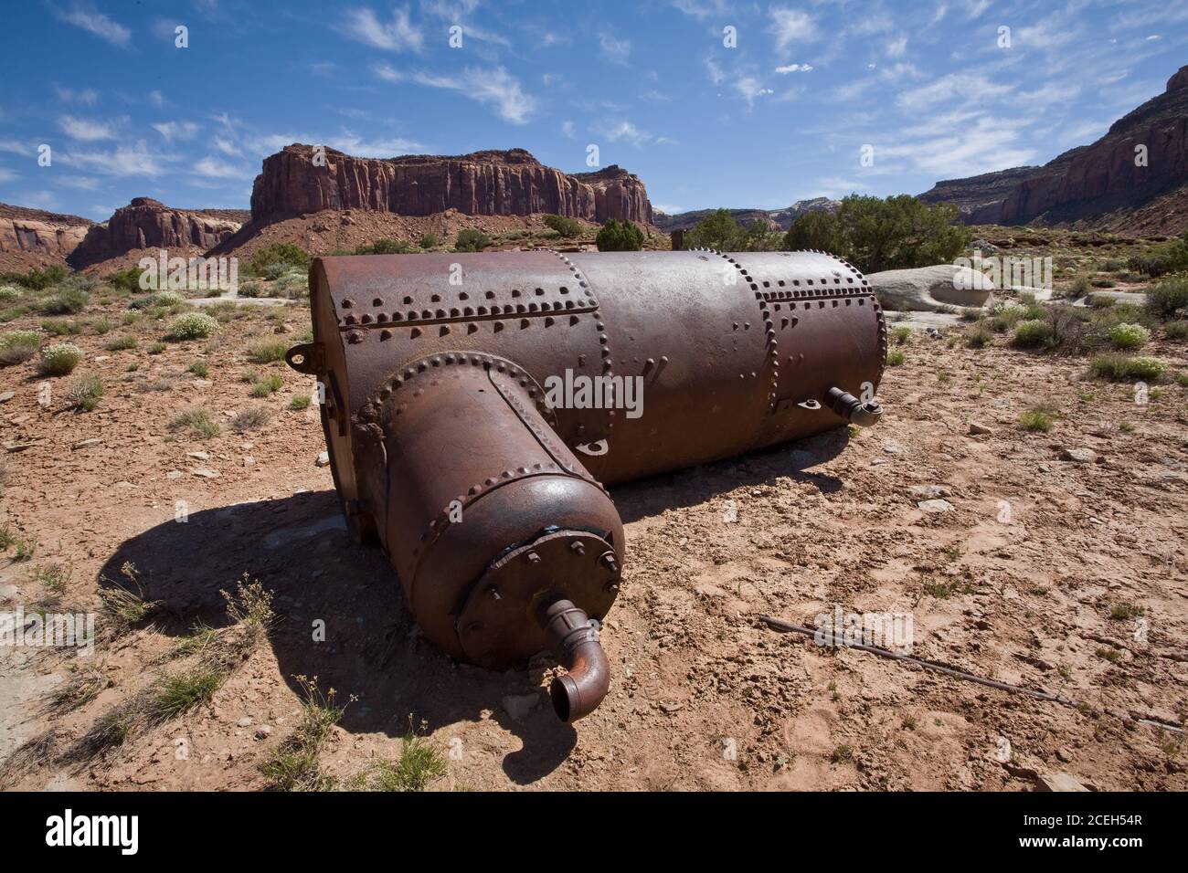 An old steam boiler at the site of an old uranium mine in the canyon country of southeastern Utah. Stock Photo