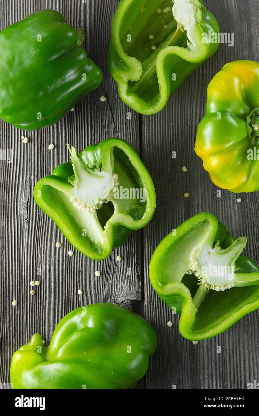 Sweet green pepper on wooden background. Fresh yellow green bell pepper (capsicum) Stock Photo