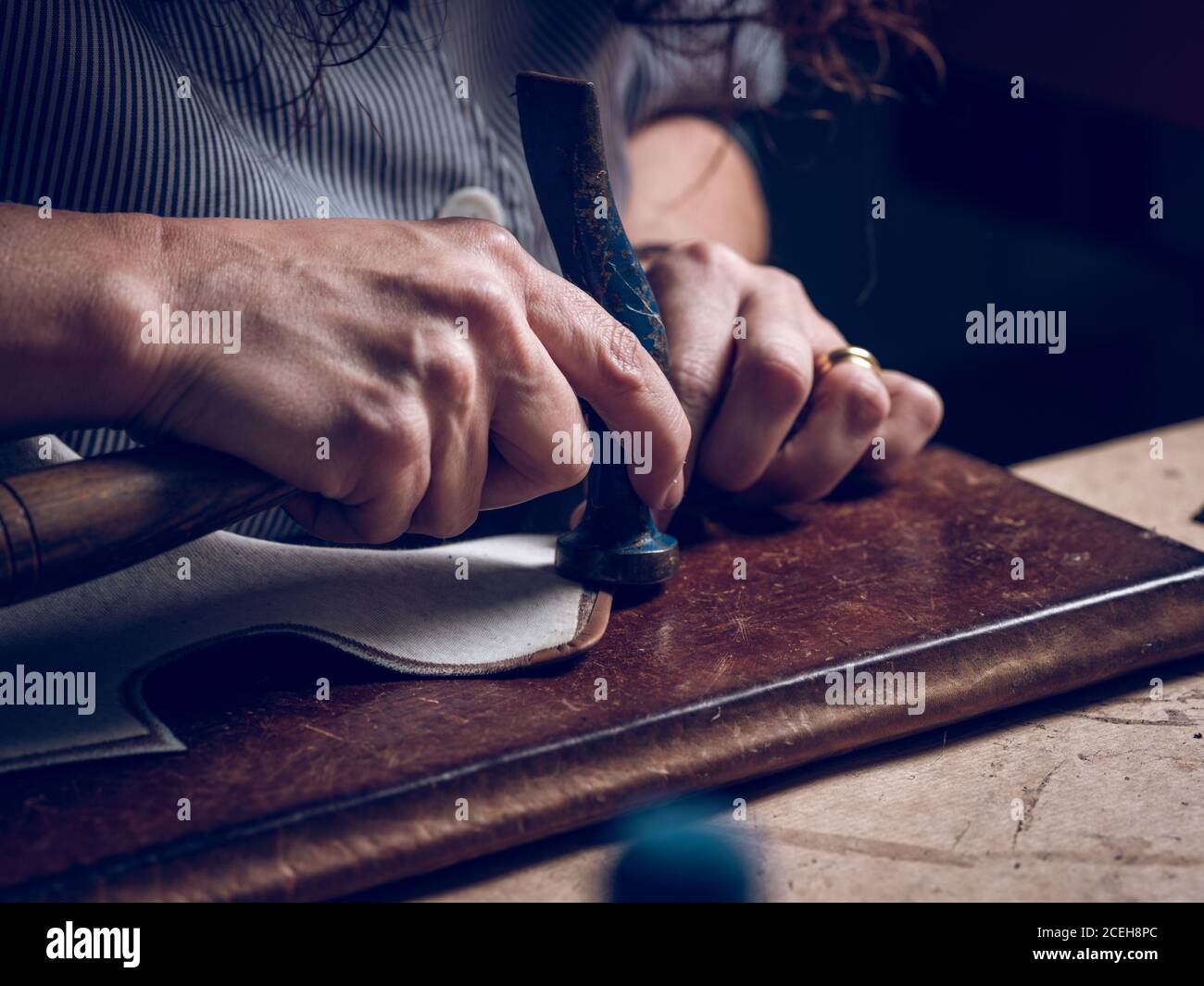 Crop craftsman working with hammer Stock Photo