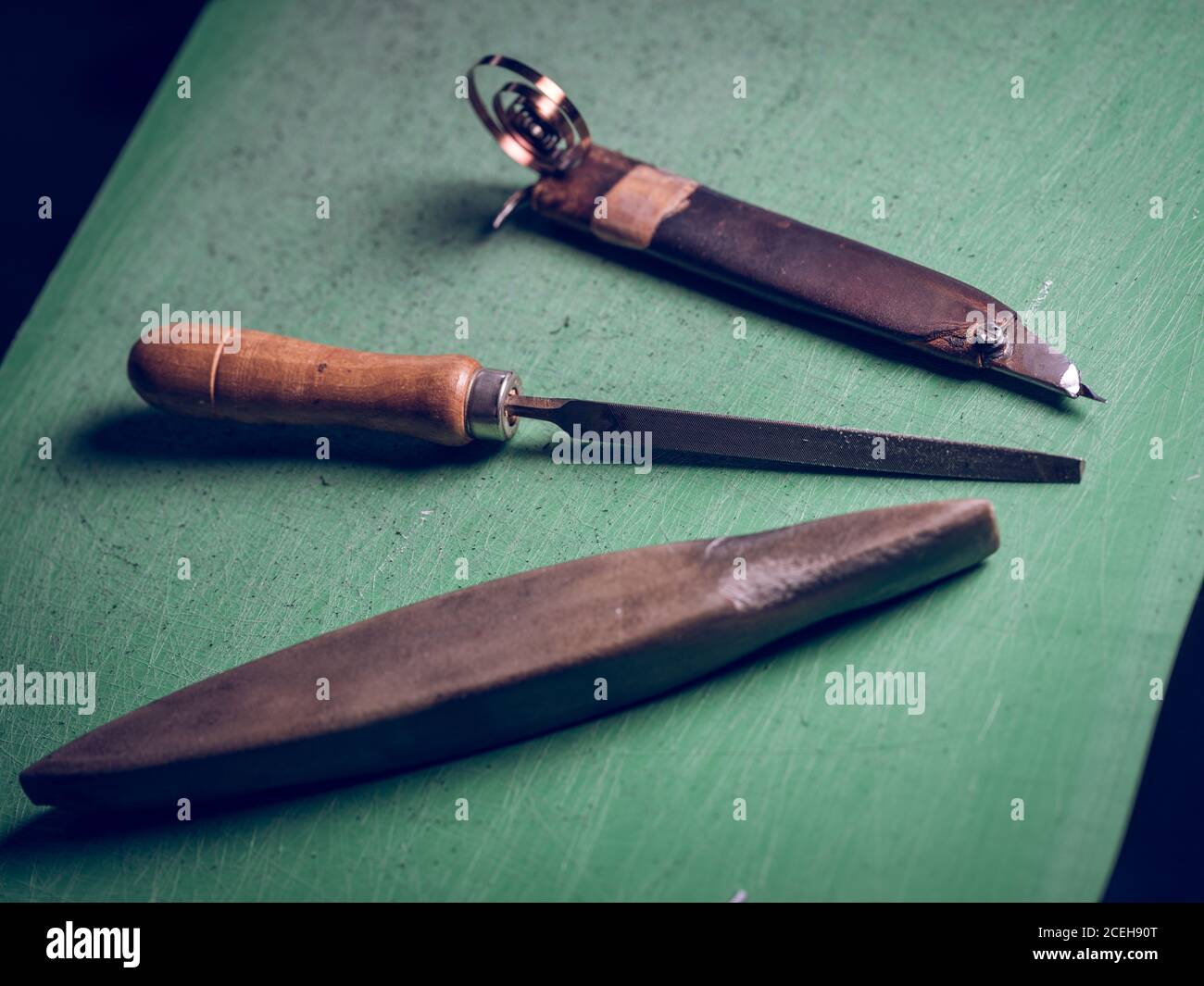 Shoe making tools lying near leather Stock Photo Alamy