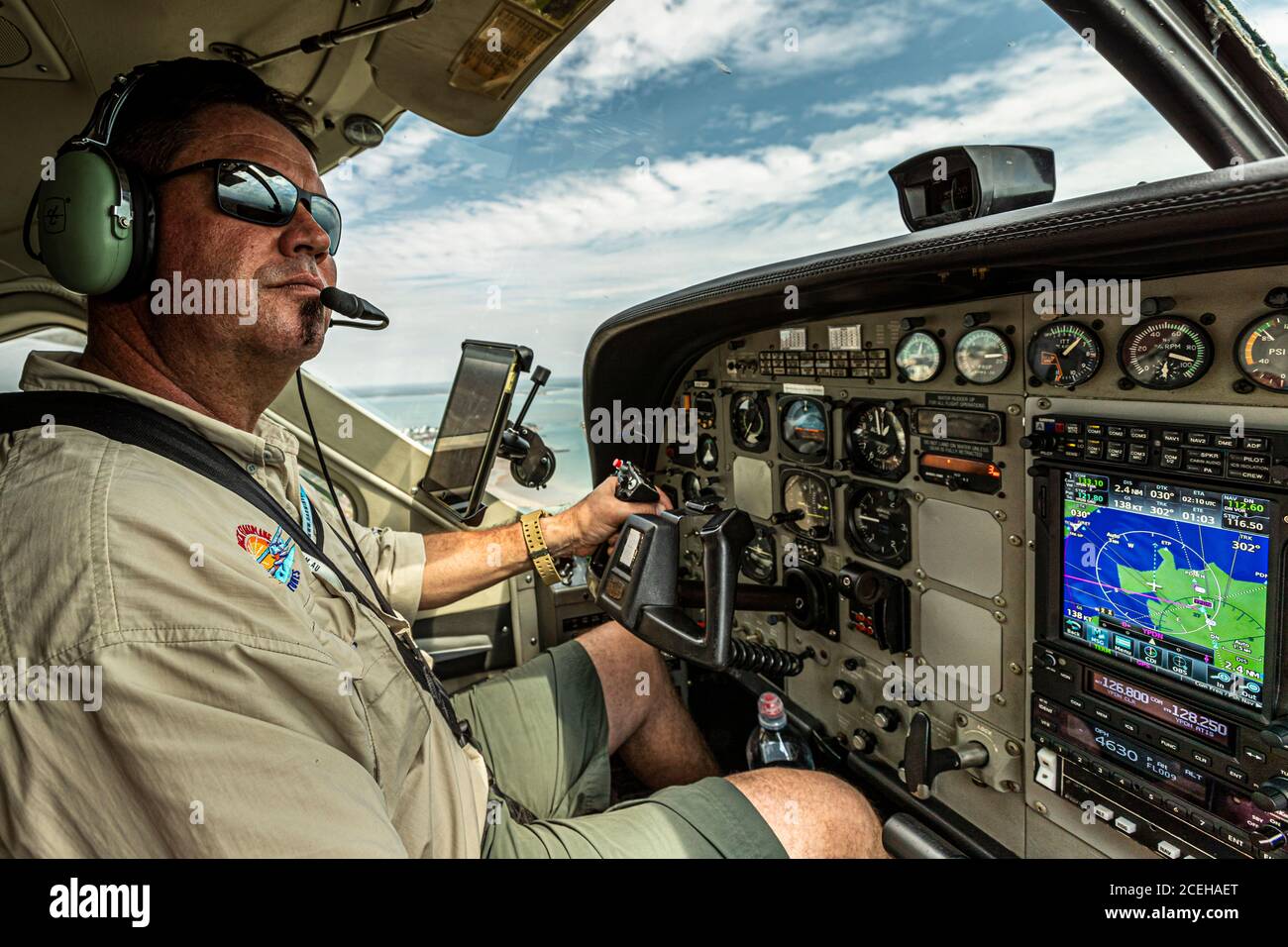 The Top End of Australia. Pilot Dave at the control stick of his float plane, with which he can take off and land on fixed runways as well as on feet and lakes Stock Photo