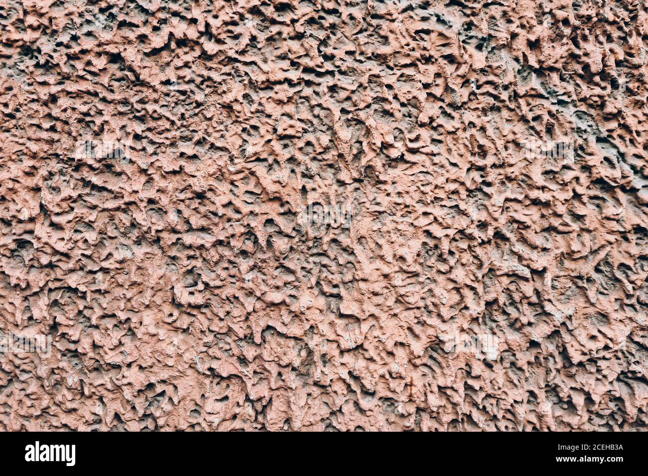Pink unusual structural plaster . Design element of an old building exteriour. Stock Photo